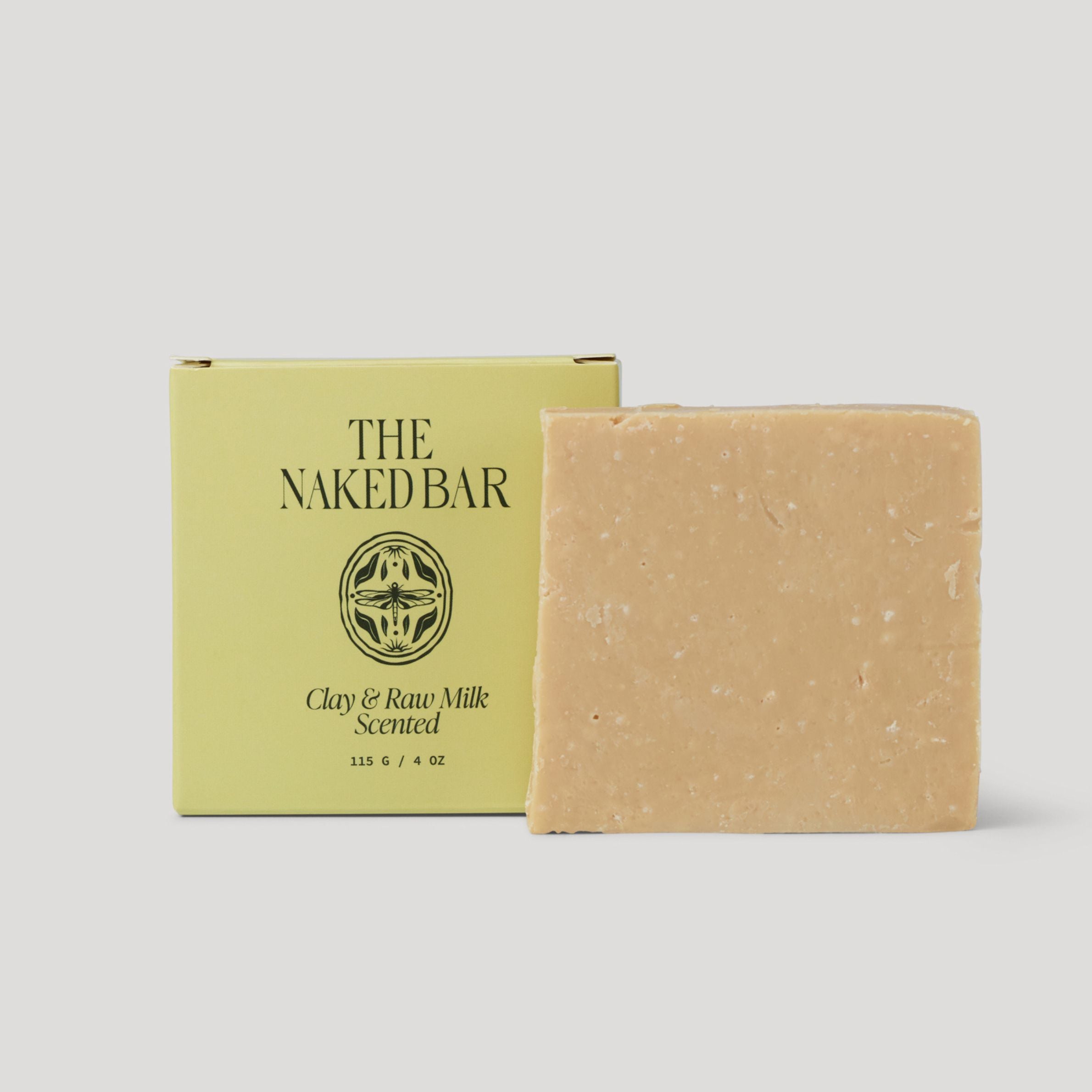 Bar of soap with 'The Naked Bar' packaging on a light gray background