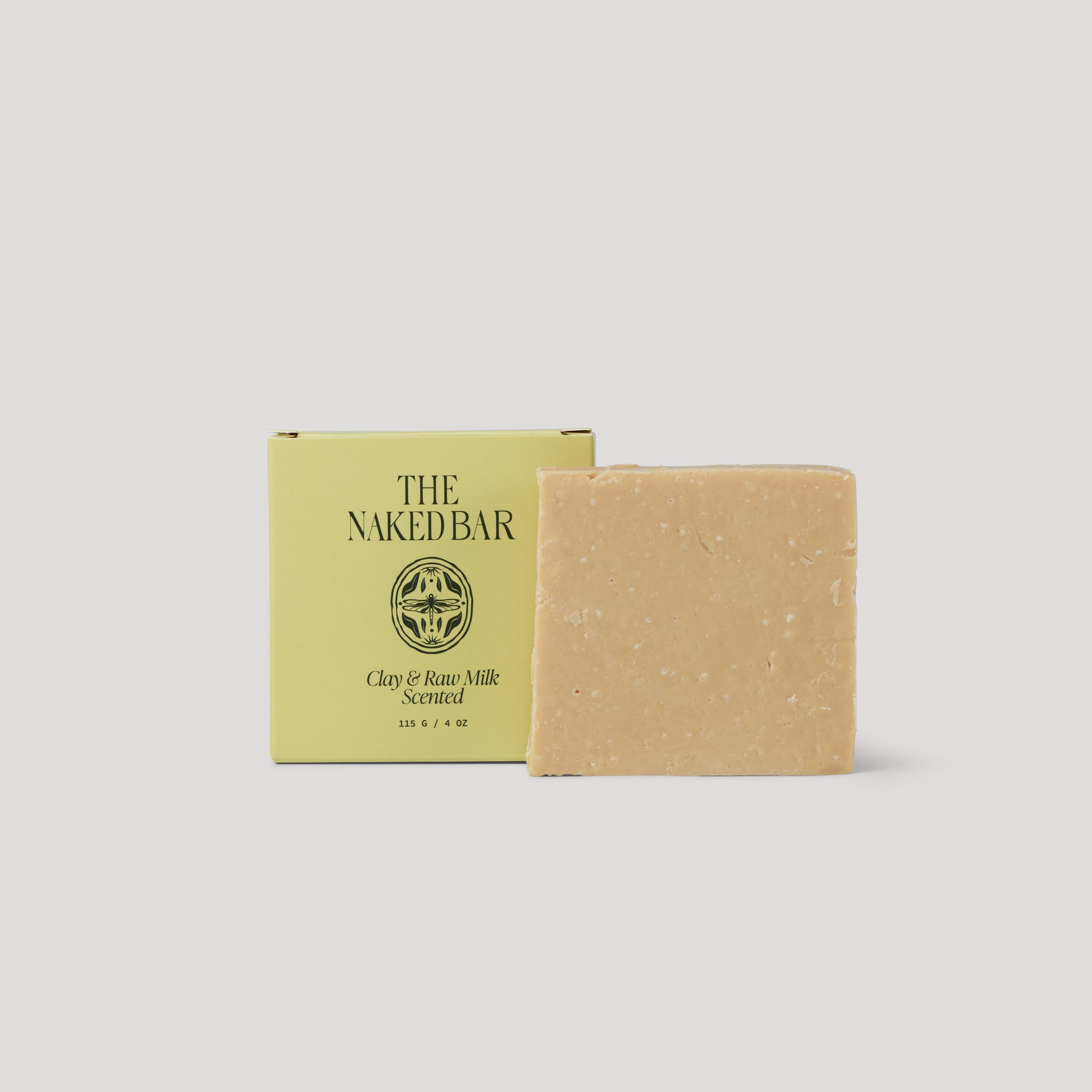 Bar of soap with a green box labeled 'The Naked Bar' on a light gray background