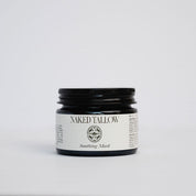 A jar of Naked Tallow Soothing Mask with a black lid and label on a white background.