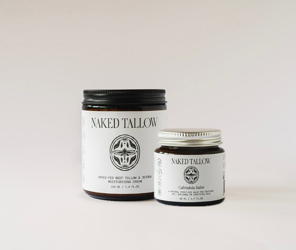 Two jars of Naked Tallow skin care products on a light background, one larger jar labeled 'Naked Tallow' and a smaller jar labeled 'Calendula Healing Balm'.