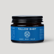Tallow Baby baby body balm jar with blue label on a light gray background